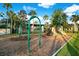 Community playground with swings, slides, and ample space for children to play safely in a Gathering-friendly area at 13622 Cygnus Dr, Orlando, FL 32828