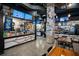 Interior of a restaurant with counter service, display screens, and modern industrial design at 13622 Cygnus Dr, Orlando, FL 32828