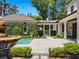 Spacious backyard with fountain and pool offering a resort-like experience at 1400 Place Picardy, Winter Park, FL 32789