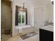 Luxurious bathroom featuring a soaking tub, a walk-in shower, and elegant fixtures at 1400 Place Picardy, Winter Park, FL 32789