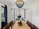 Stylish dining room view showcasing modern decor, elegant lighting, and an open view to the living space at 1400 Place Picardy, Winter Park, FL 32789