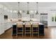 Bright, spacious kitchen featuring a large island, modern appliances, and custom white cabinetry at 1400 Place Picardy, Winter Park, FL 32789