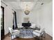 Bright living room featuring modern furnishings, a stylish chandelier, and an area rug at 1400 Place Picardy, Winter Park, FL 32789