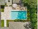 Aerial view of outdoor oasis featuring a pool, lounge area, and manicured landscape at 1400 Place Picardy, Winter Park, FL 32789