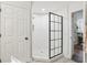 Bathroom showcasing a sleek, glass shower with geometric tile flooring at 1578 Farrindon Cir # 1578, Lake Mary, FL 32746