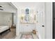 Bathroom with a granite vanity, wood-look flooring, and decorative mirror at 1578 Farrindon Cir # 1578, Lake Mary, FL 32746