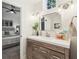 Tastefully updated bathroom has a sleek vanity and finishes with an adjacent bedroom with neutral color scheme at 1578 Farrindon Cir # 1578, Lake Mary, FL 32746