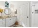 Bathroom with a granite vanity, wood-look flooring, and decorative mirror at 1578 Farrindon Cir # 1578, Lake Mary, FL 32746