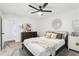 This bedroom boasts light, airy walls, a ceiling fan and neutral decor at 1578 Farrindon Cir # 1578, Lake Mary, FL 32746