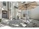 Private patio featuring stone pavers, a retractable awning and lush landscaping for outdoor relaxation at 1578 Farrindon Cir # 1578, Lake Mary, FL 32746