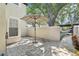 Private patio featuring stone pavers, a retractable awning and lush landscaping for outdoor relaxation at 1578 Farrindon Cir # 1578, Lake Mary, FL 32746