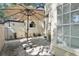 Secluded backyard patio area with brick pavers and a sunshade for a comfortable outdoor experience at 1578 Farrindon Cir # 1578, Lake Mary, FL 32746