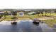 Beautiful waterfront home with dock, in a well landscaped neighborhood with mature trees at 16054 Johns Lake Overlook Dr, Winter Garden, FL 34787
