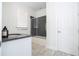 Modern bathroom with sleek vanity, contemporary fixtures, and a glass-enclosed shower, blending style and functionality at 16054 Johns Lake Overlook Dr, Winter Garden, FL 34787