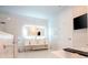 Modern bathroom with a soaking tub and walk-in shower and vanity with an LED mirror at 16054 Johns Lake Overlook Dr, Winter Garden, FL 34787
