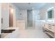 This luxury bathroom features dual head shower and vanity with vessel sink with LED mirror at 16054 Johns Lake Overlook Dr, Winter Garden, FL 34787