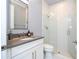 A modern bathroom featuring a glass enclosed shower at 16054 Johns Lake Overlook Dr, Winter Garden, FL 34787