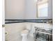 Elegant bathroom with white marble tile, sink with stainless steel frame, and modern fixtures at 16054 Johns Lake Overlook Dr, Winter Garden, FL 34787