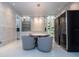 Stylish dining space showcasing a modern chandelier, built-in wine storage, and inviting seating at 16054 Johns Lake Overlook Dr, Winter Garden, FL 34787