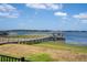 Private boat dock and lift on a tranquil lake, offering direct water access at 16054 Johns Lake Overlook Dr, Winter Garden, FL 34787