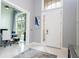 Inviting foyer featuring a glimpse into the office and front entrance at 16054 Johns Lake Overlook Dr, Winter Garden, FL 34787