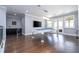 This game room features dark hardwood floors, pool table, wet bar and lots of light from a balcony at 16054 Johns Lake Overlook Dr, Winter Garden, FL 34787