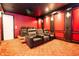 Watch movies in style in this home theater, featuring comfortable seating and a projector for an immersive cinematic experience at 16054 Johns Lake Overlook Dr, Winter Garden, FL 34787