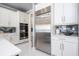 Modern kitchen with stainless steel appliances, countertops, and backsplash at 16054 Johns Lake Overlook Dr, Winter Garden, FL 34787