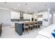 Spacious open kitchen with a large center island, stainless steel appliances and modern finishes at 16054 Johns Lake Overlook Dr, Winter Garden, FL 34787