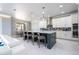 Open concept kitchen with a large island, modern appliances, and ample seating at 16054 Johns Lake Overlook Dr, Winter Garden, FL 34787