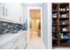 Kitchen featuring ample counter space, modern appliances, and a large pantry at 16054 Johns Lake Overlook Dr, Winter Garden, FL 34787