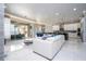 Expansive open floor plan with a living area overlooking a serene outdoor space at 16054 Johns Lake Overlook Dr, Winter Garden, FL 34787