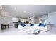 Spacious open-concept floorplan with modern kitchen, living room, and dining area for easy entertaining at 16054 Johns Lake Overlook Dr, Winter Garden, FL 34787