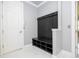 Convenient mudroom features a built-in bench with storage, creating an organized entryway at 16054 Johns Lake Overlook Dr, Winter Garden, FL 34787