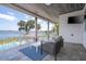 Comfortable outdoor patio features stylish seating and stunning lake views with access to the pool at 16054 Johns Lake Overlook Dr, Winter Garden, FL 34787