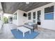 Stylish outdoor patio complete with comfortable seating, lake views, and seamless indoor-outdoor flow at 16054 Johns Lake Overlook Dr, Winter Garden, FL 34787