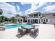 Lavish outdoor pool and patio area with a gazebo and sleek furniture at 16054 Johns Lake Overlook Dr, Winter Garden, FL 34787