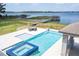 Lakefront pool with spa, cabana, and private dock offers endless opportunities for waterfront enjoyment at 16054 Johns Lake Overlook Dr, Winter Garden, FL 34787