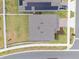 Aerial view of a home with a large yard and a gray roof in a sidewalk neighborhood at 1616 Eucalyptus Way, Davenport, FL 33837