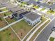 Aerial view of a home with a large fenced yard and a gray roof in a sidewalk neighborhood at 1616 Eucalyptus Way, Davenport, FL 33837