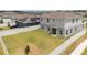 Aerial view of a large fenced backyard featuring green grass and shade trees in a sidewalk neighborhood at 1616 Eucalyptus Way, Davenport, FL 33837