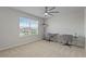 Neutral bedroom showcasing large window and dual desks, perfect for working from home at 1616 Eucalyptus Way, Davenport, FL 33837