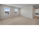 Upstairs bedroom featuring carpet, a window with blinds, and a neutral paint scheme at 1616 Eucalyptus Way, Davenport, FL 33837