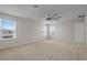Bright bedroom featuring neutral carpet and windows with pleasant neighborhood views at 1616 Eucalyptus Way, Davenport, FL 33837