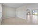 Open dining room with tile flooring, neutral walls, and sliding glass doors leading to the backyard at 1616 Eucalyptus Way, Davenport, FL 33837