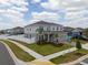 Two-story home features well-manicured lawn, landscaping, and a two-car garage in a sidewalk neighborhood at 1616 Eucalyptus Way, Davenport, FL 33837