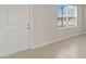 Bright foyer with tile flooring, a white front door, and a window providing natural light at 1616 Eucalyptus Way, Davenport, FL 33837