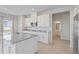Modern kitchen with a large island, granite countertops and stainless appliances at 1616 Eucalyptus Way, Davenport, FL 33837