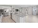Open kitchen featuring granite countertops, stainless steel appliances, and tile flooring at 1616 Eucalyptus Way, Davenport, FL 33837