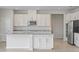 Modern kitchen featuring granite countertops and stainless steel appliances at 1616 Eucalyptus Way, Davenport, FL 33837